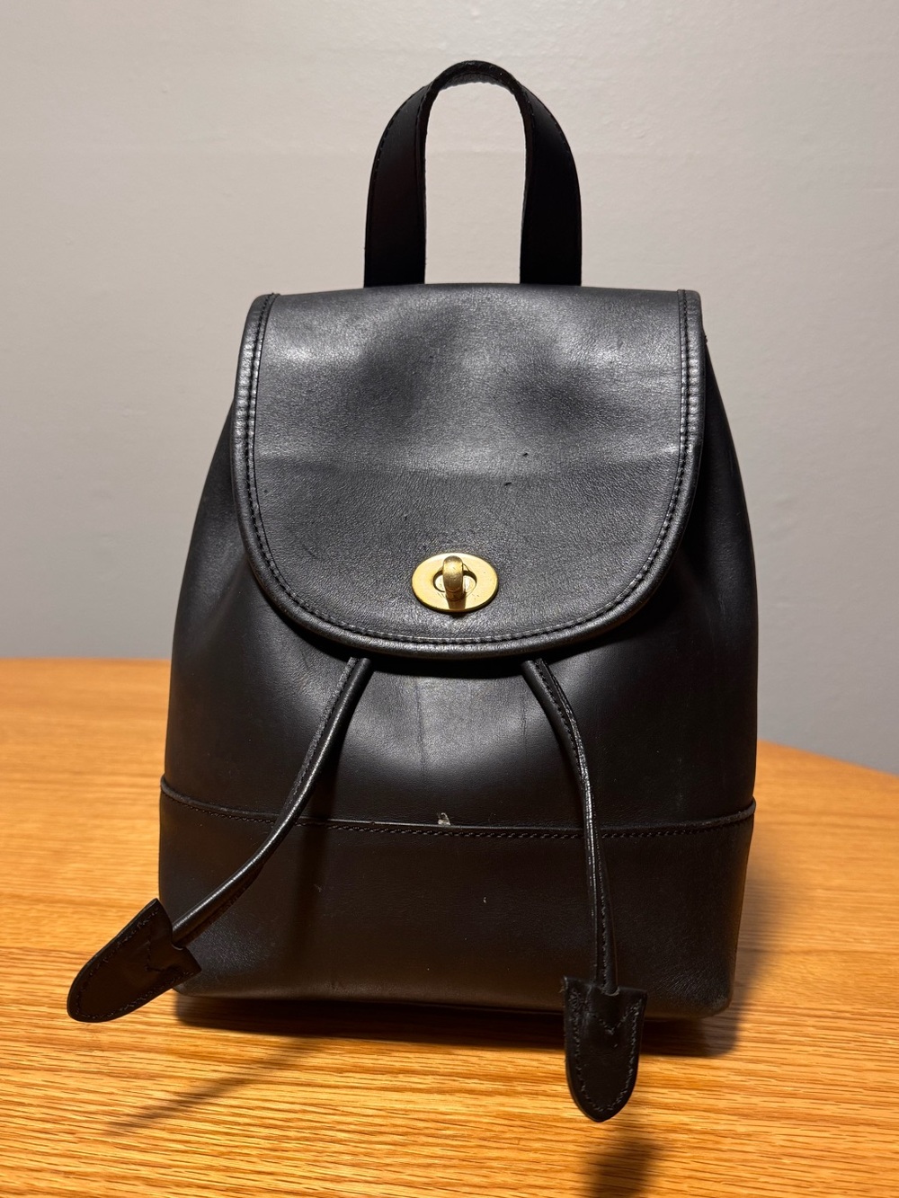 Vintage Coach Minimal Black Leather Drawstring Backpack with Gold Twist Lock